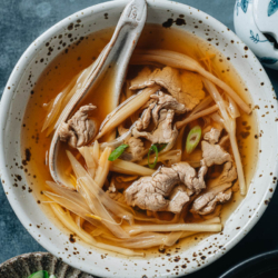 A fast and easy sliced pork soup made with aromatics and lily flowers for a hearty yet refreshing taste. It is a great dish to make when you feel under the weather, to gain strength during postpartum, or if you simply need a comforting soup for dinner. {Gluten-Free Adaptable}