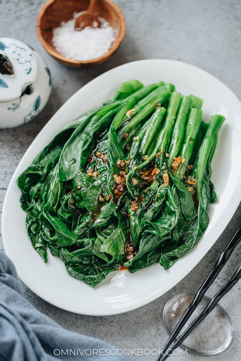 Blanched choy sum with garlic sauce close up