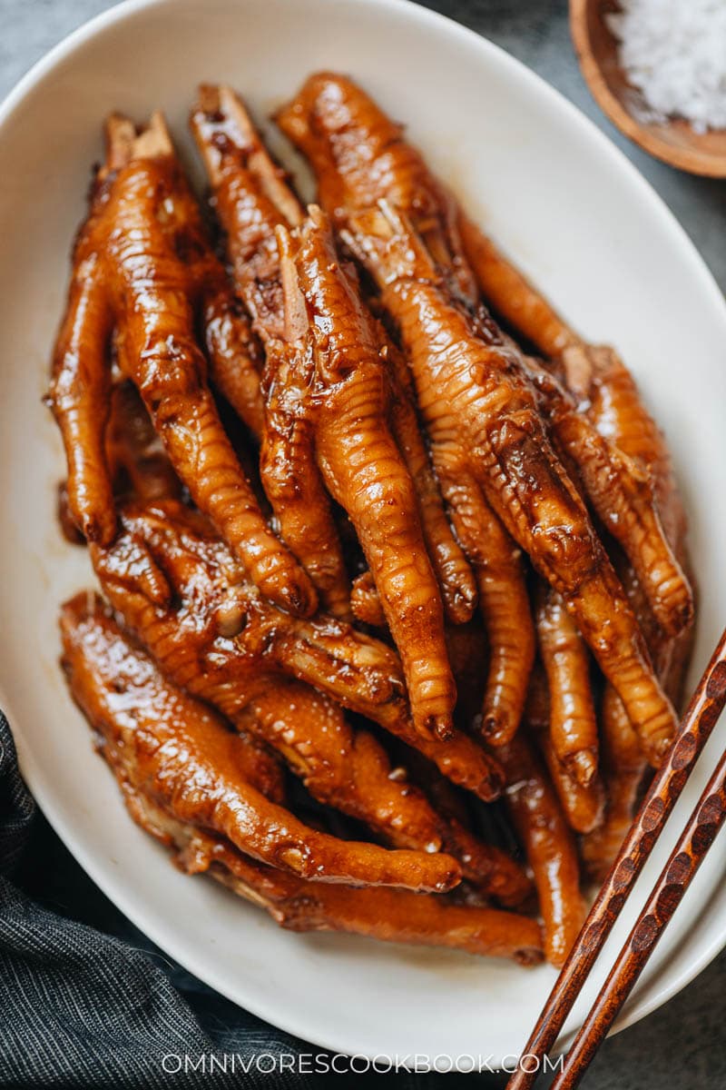 Braised chicken feet in a plate close up
