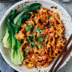 Biang Biang noodles show you the power of simplicity. With a spoonful of savory seasoned soy sauce and fresh, nutty hot sauce, these thick and meaty handmade noodles will send you into flavor ecstasy! {Vegetarian, Vegan}