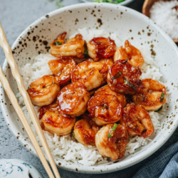 Honey garlic shrimp is a super easy takeout dish you can put together quickly for your weekday dinner. The tender and juicy shrimp are cooked with a sweet sauce and plenty of aromatics. Serve it on steamed rice and you’ll have dinner ready in 20 minutes!