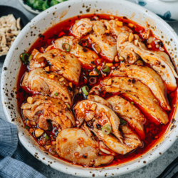 Experience the authentic flavors of Sichuan cuisine with this mouth-watering recipe for saliva chicken. The dish features tender juicy chicken smothered in a rich and spicy sauce that is bursting with umami, just like the one served in China.