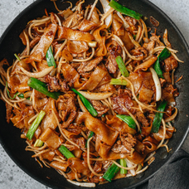 Homemade beef chow fun in a pan