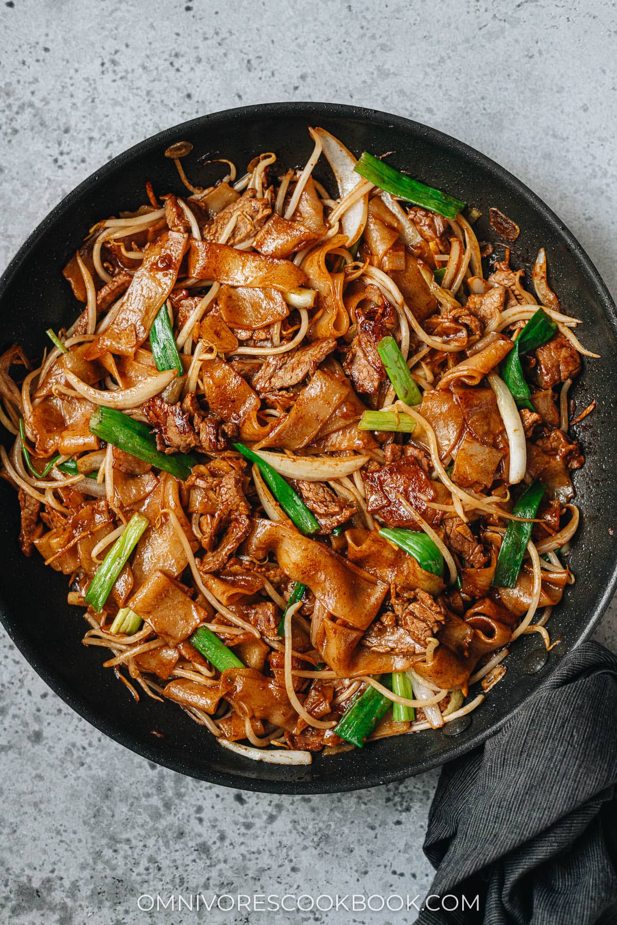 Homemade beef chow fun in a pan