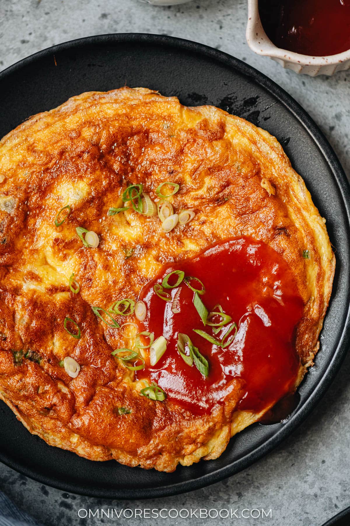 Oyster omelet with sauce close up