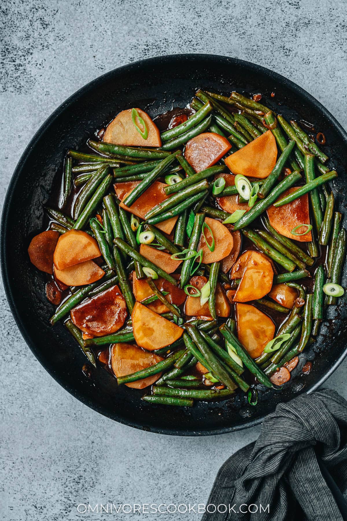 Chinese style green bean and potato stew in a pan