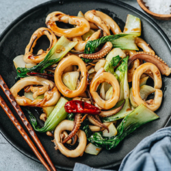 Squid and bok choy stir fry is a simple Chinese homestyle dish that is healthy and satisfying. The squid is cooked until just tender, then stir fried with crisp bok choy in a savory and slightly sweet sauce.