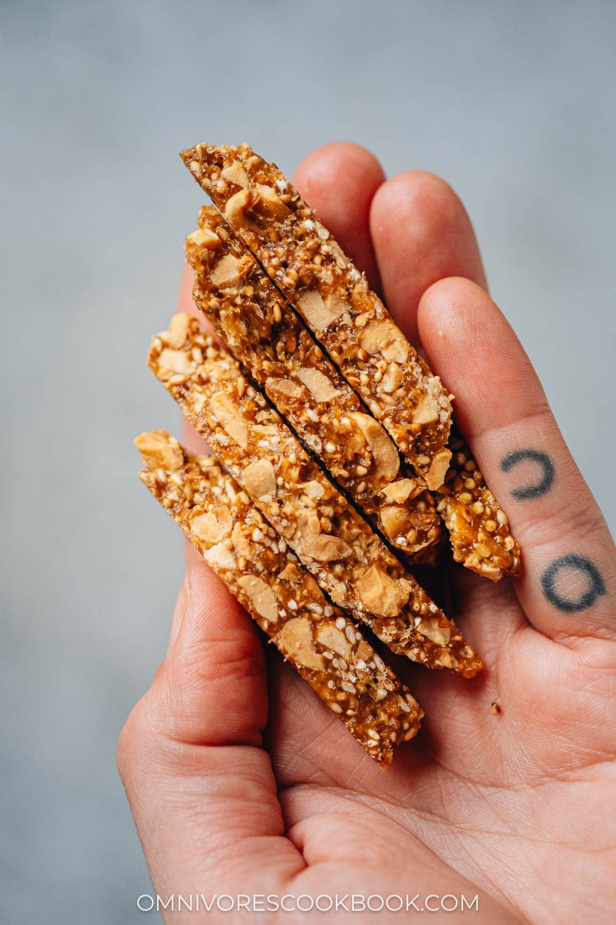 Holding Chinese peanut brittle