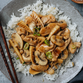 Mushroom chicken stir fry over rice close up