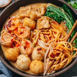 Satay noodle soup is a hearty one bowl meal with a rich seafood broth and thick, chewy noodles paired with fish balls, shrimp and veggies. It is quite easy to put together and so comforting.