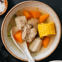 Chinese pork and corn soup is a comforting dish on a cold day. It features tender pork ribs, and sweet corn on the cob and carrot in a gingery broth that’s full of umami. It makes a nutritious light meal by itself, is great for cooking ahead and serving later, and is wonderful for postpartum nourishment and recovery. {Gluten-Free Adaptable}