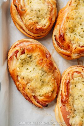 Chinese bakery style ham and cheese buns on a tray