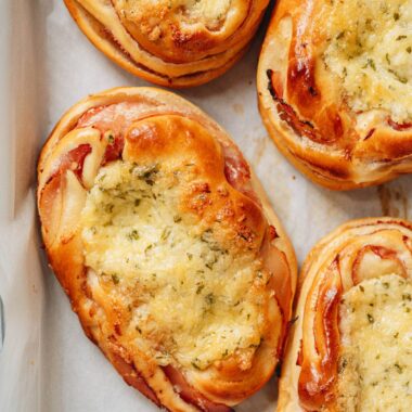 Chinese bakery style ham and cheese buns on a tray