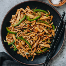 King oyster mushroom stir fry is a vegetarian dish that is packed with umami and is quick to make. The mushrooms are shredded and are cooked in a brown sauce that is slightly sweet and spicy. It is a dish that will satisfy your craving and is low in calories. {Vegetarian, Gluten-Free Adaptable}