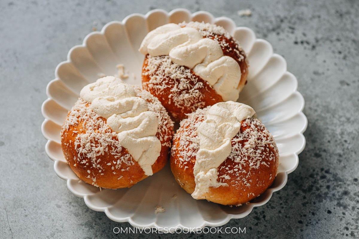 Homemade coconut cream buns in a plate