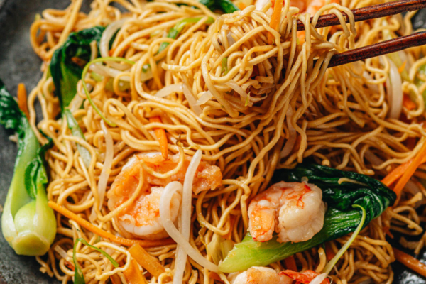 Shrimp chow mein pulled with chopsticks