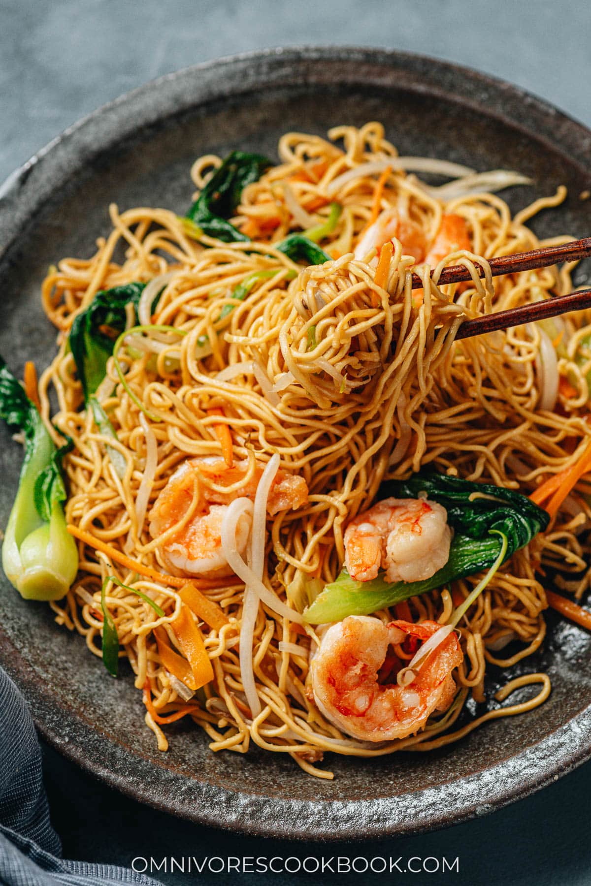 Shrimp chow mein pulled with chopsticks