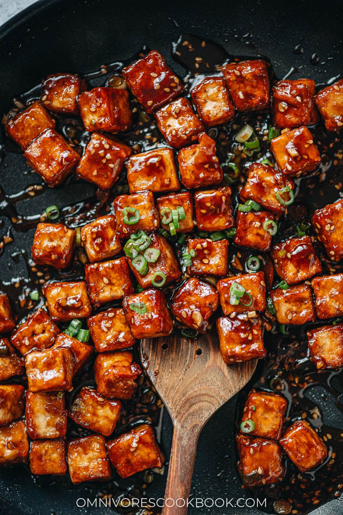 Crispy sesame tofu in a pan close up