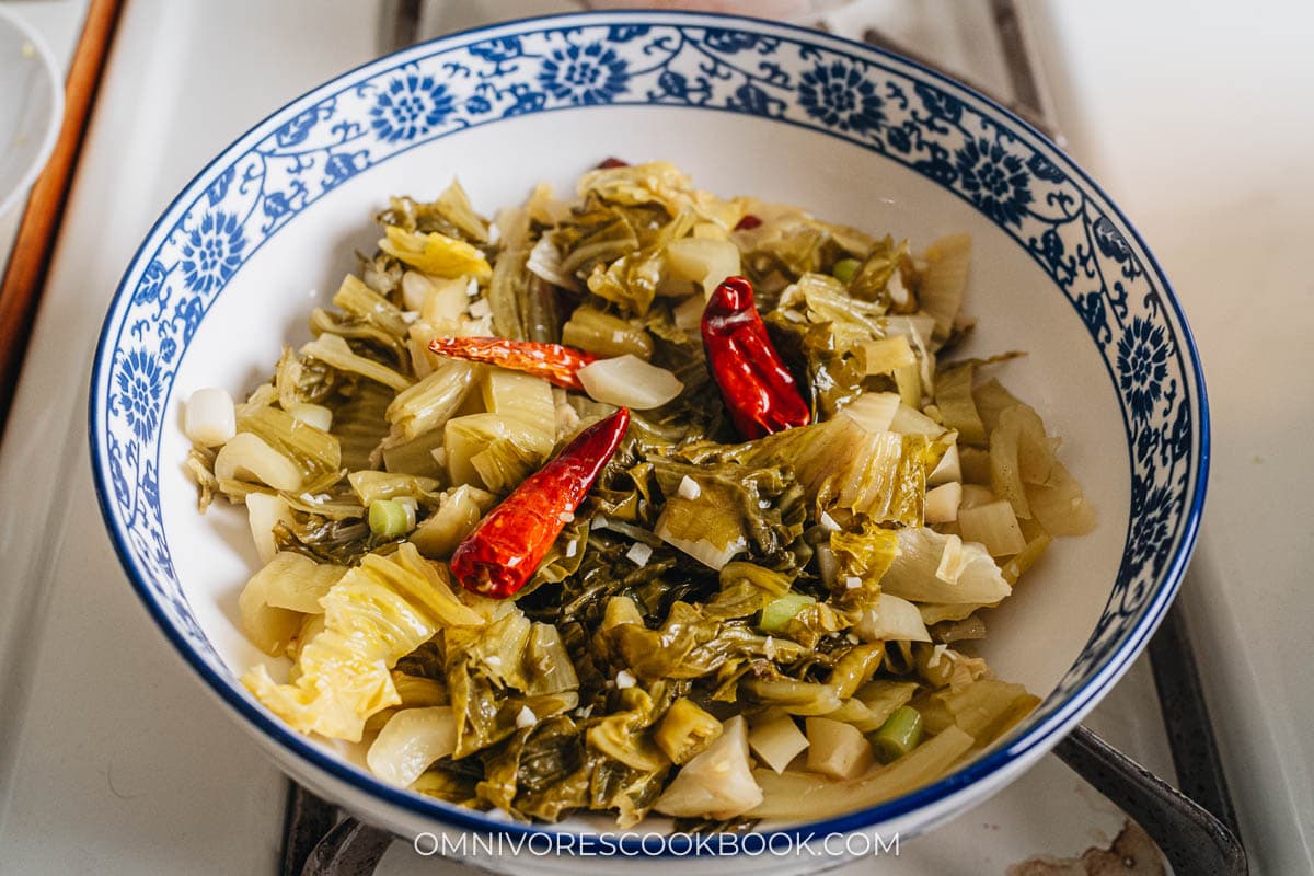 Pickled mustard greens in a big bowl