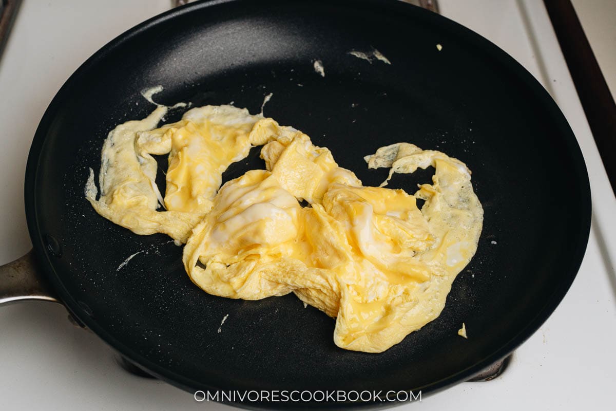 Scramble eggs in a pan