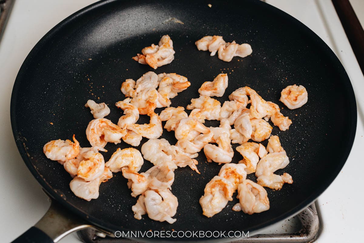 Searing shrimp in a pan