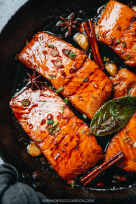 Honey glazed salmon in a pan close up