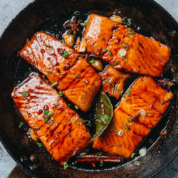 A simple yet rich tasting honey glazed salmon that features moist, tender salmon glazed with a balanced sauce that is savory, sweet, and bursting with aroma.