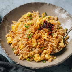 A Chinese style garlic fried rice featuring crispy rice and tender eggs stir fried with a savory sauce that has a strong garlic aroma. It is a side dish, but it tastes so good that I wouldn’t mind serving it as a main. {Vegetarian and Gluten-Free Adaptable}