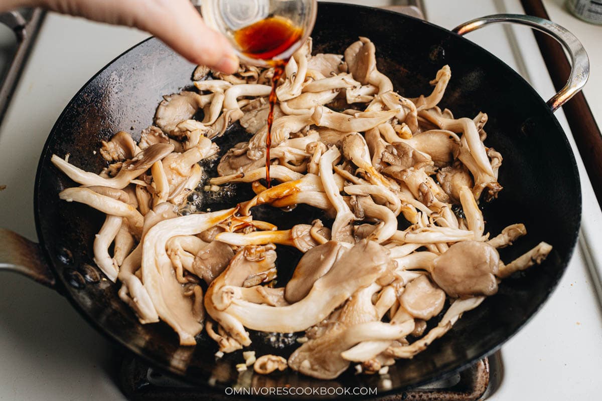 Pour in the light soy sauce into the pan