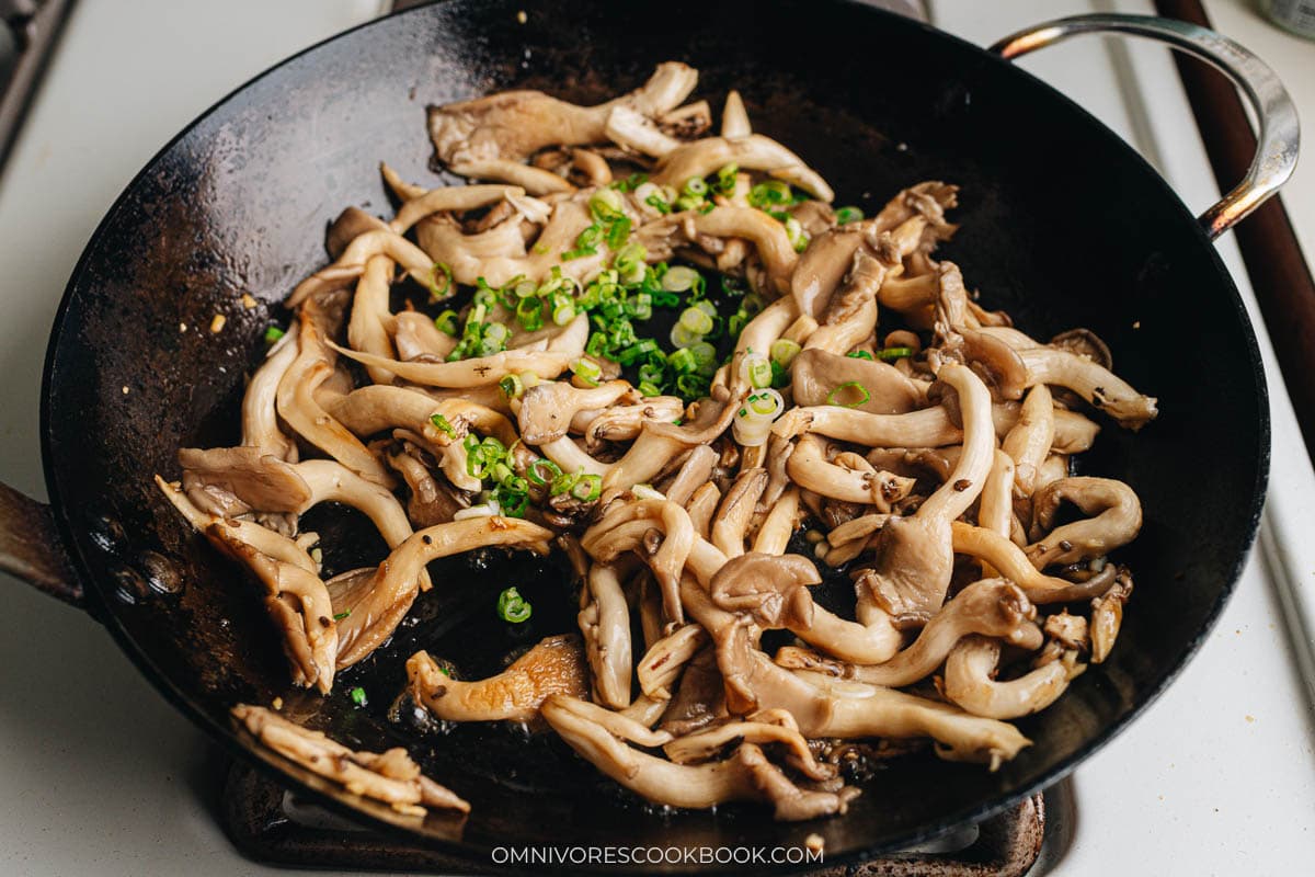 Adding green onion to finish up the dish