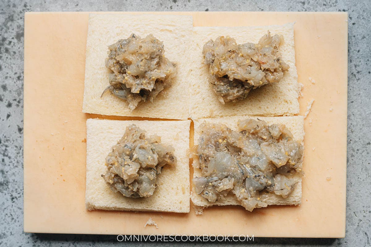 Portion out the topping onto the bread slices