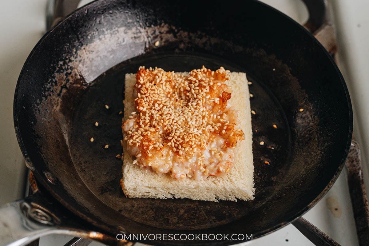 Frying shrimp toast in a pan