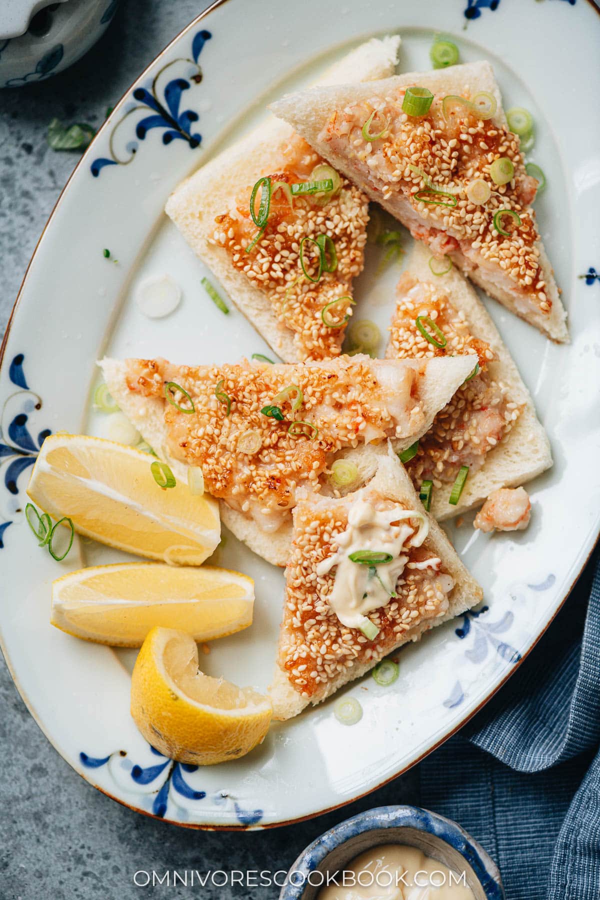 Shrimp toast served with mayo and lemon