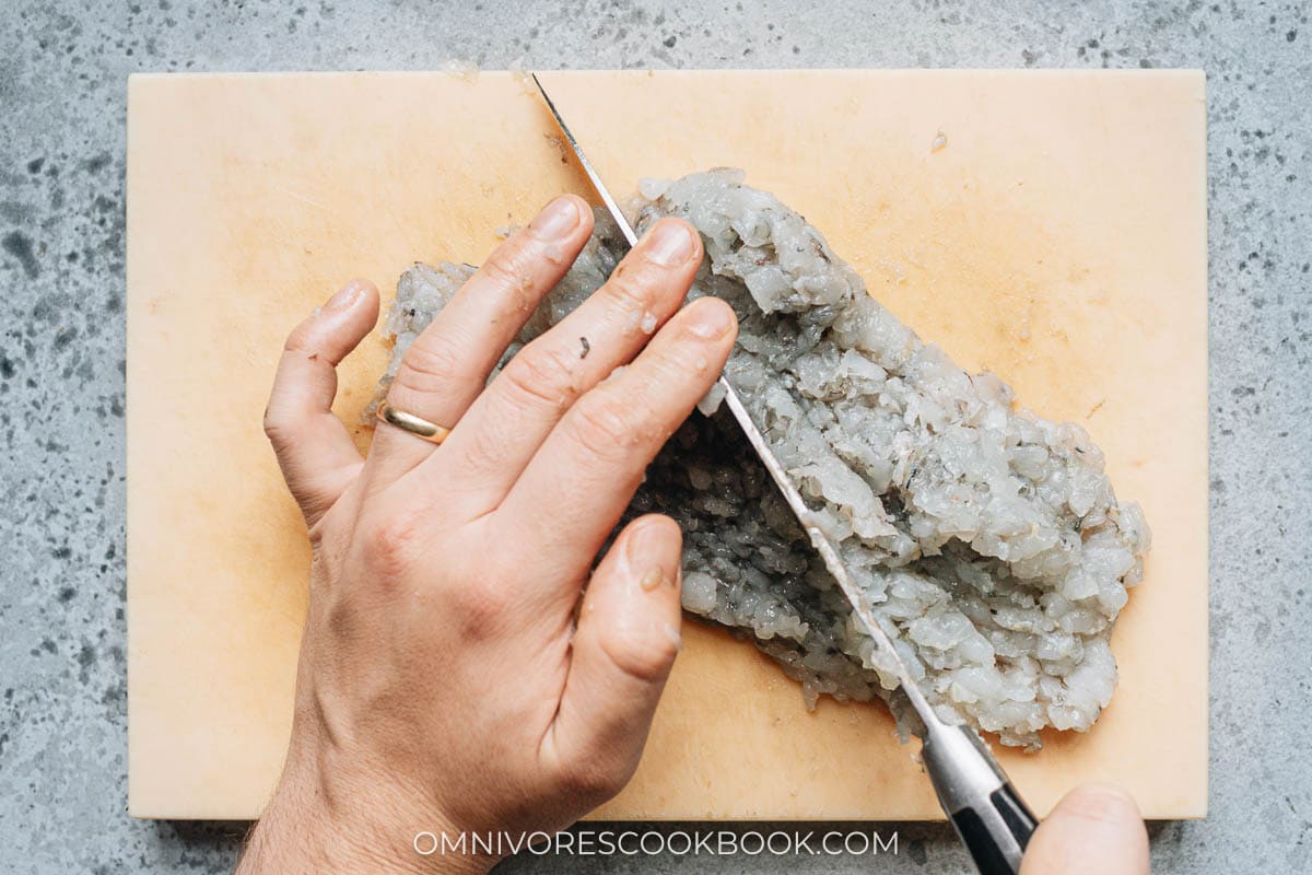 Mincing shrimp with a knife