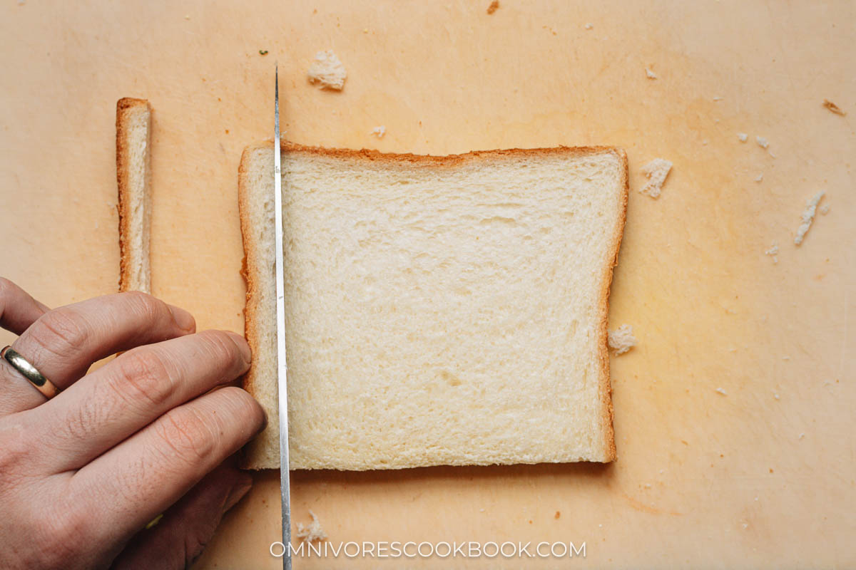 Slicing the edges off the bread