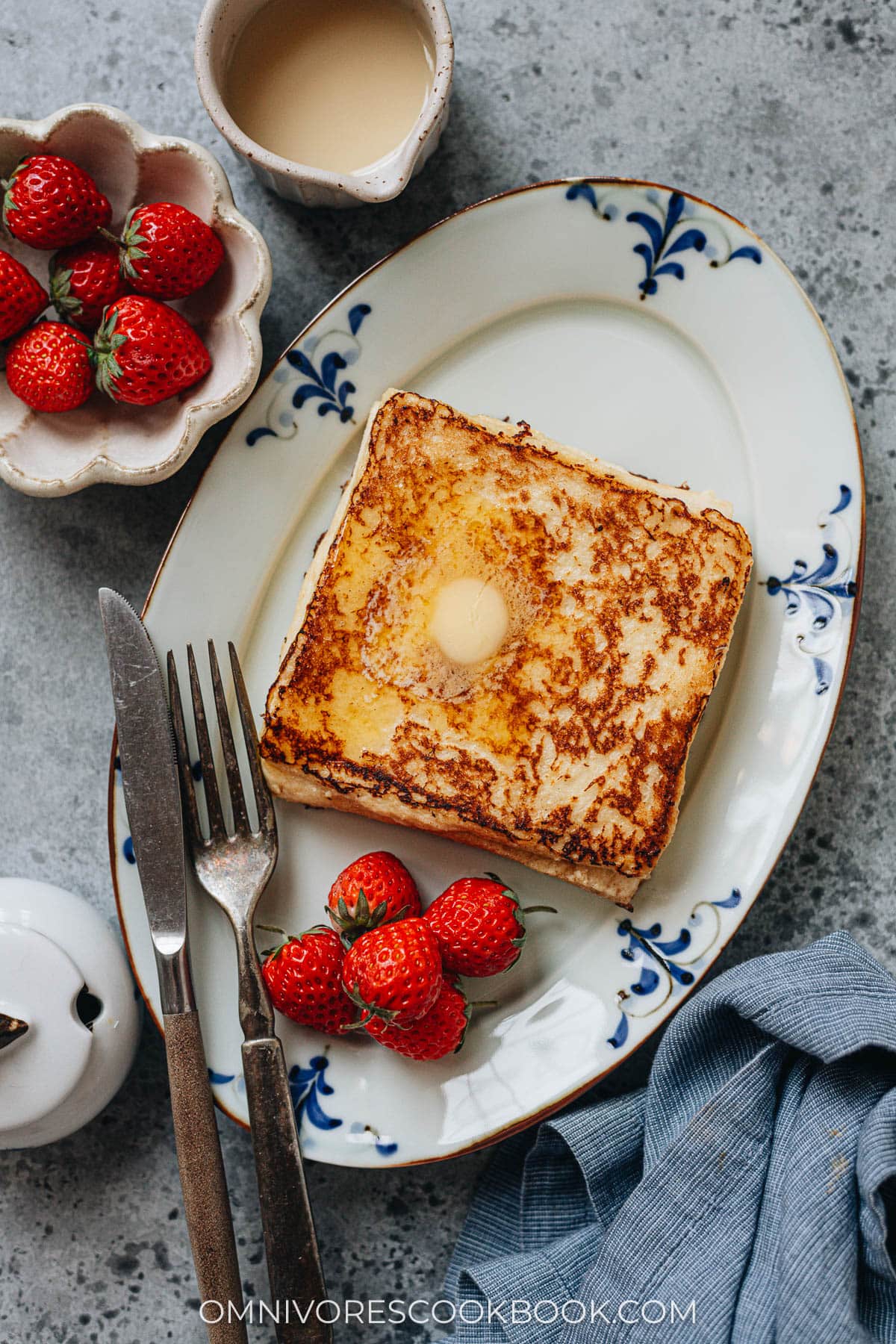 Hong Kong French toast topped with butter served with strawberries