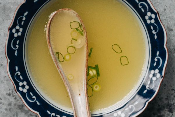 Chinese chicken stock served in a soup bowl