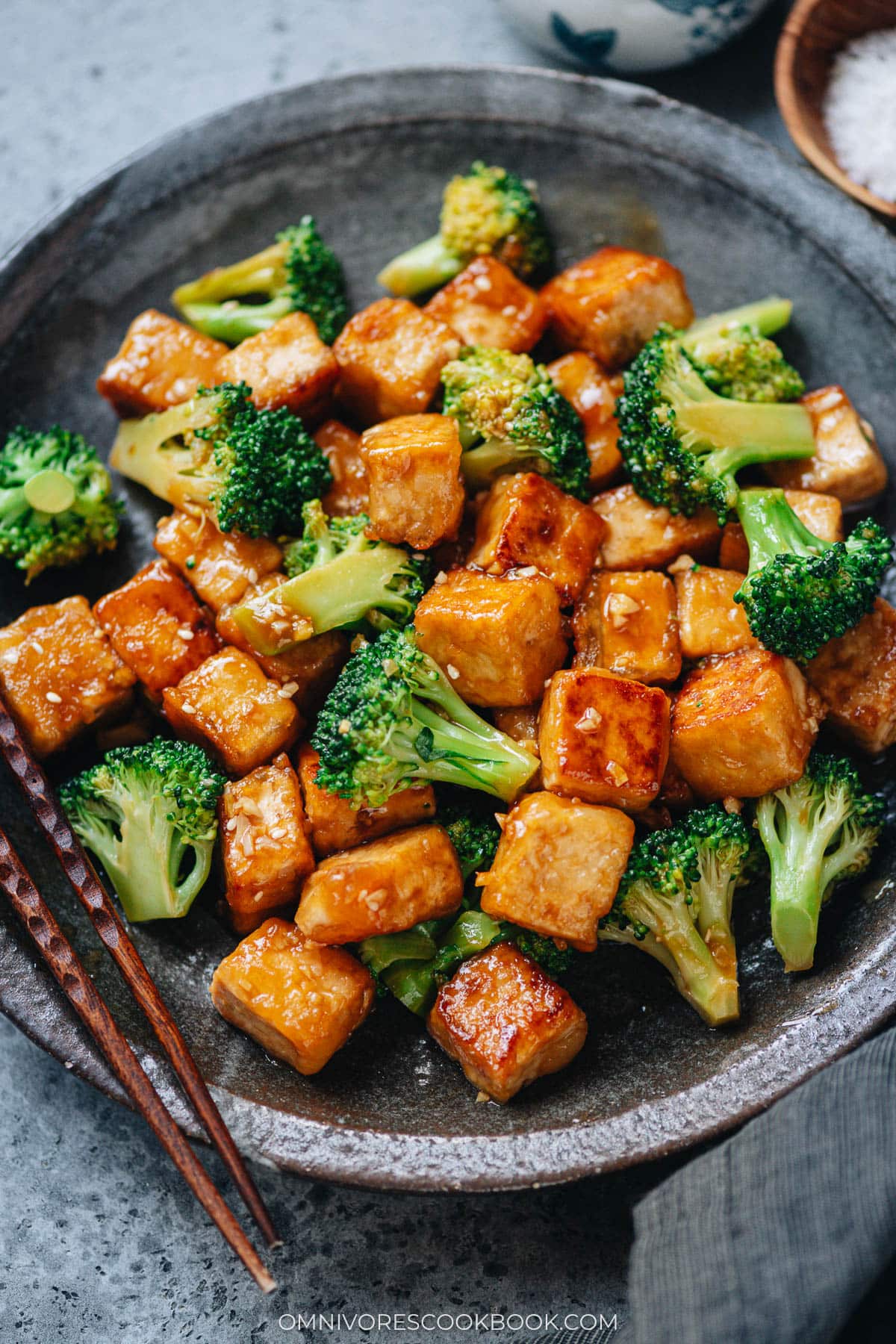 Tofu with broccoli in brown close up