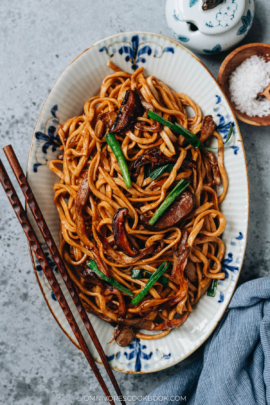 Yi Mein stir fried with mushrooms served in a plate