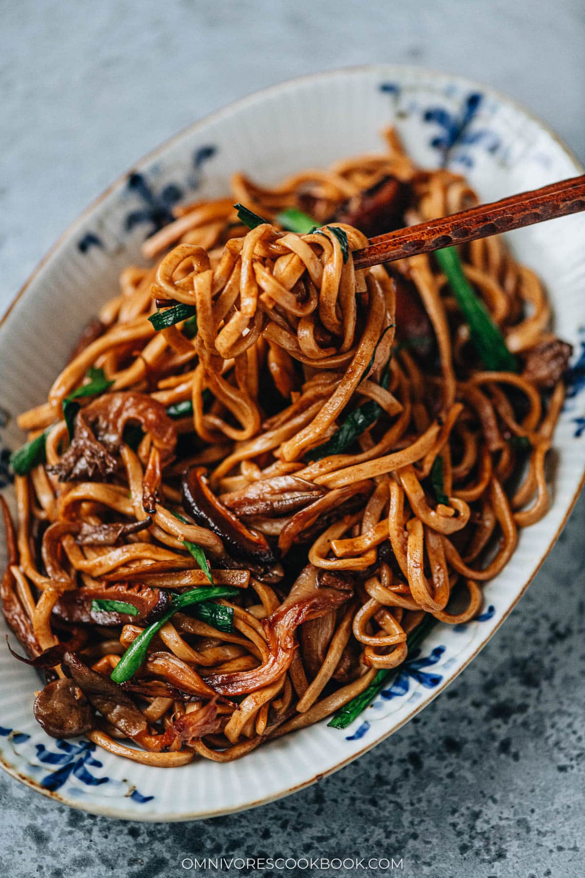 Pulling longevity noodles using chopsticks