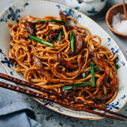 Celebrate Lunar New Year with these longevity noodles made with chewy Yi Mein and mushrooms, brought together with a savory brown sauce and aromatics. {Vegetarian-Adaptable}