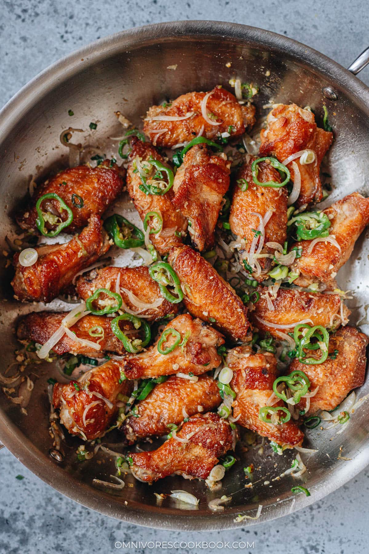 Homemade salt and pepper chicken wings in a skillet