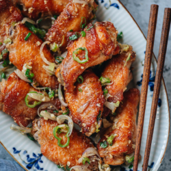 Make crispy and juicy salt and pepper chicken wings that are bursting with flavor using this oven baked method. The wings are marinated briefly, lightly breaded and baked until golden crispy, then cooked with aromatics and spices for a rich flavor. {Gluten-Free Adaptable}