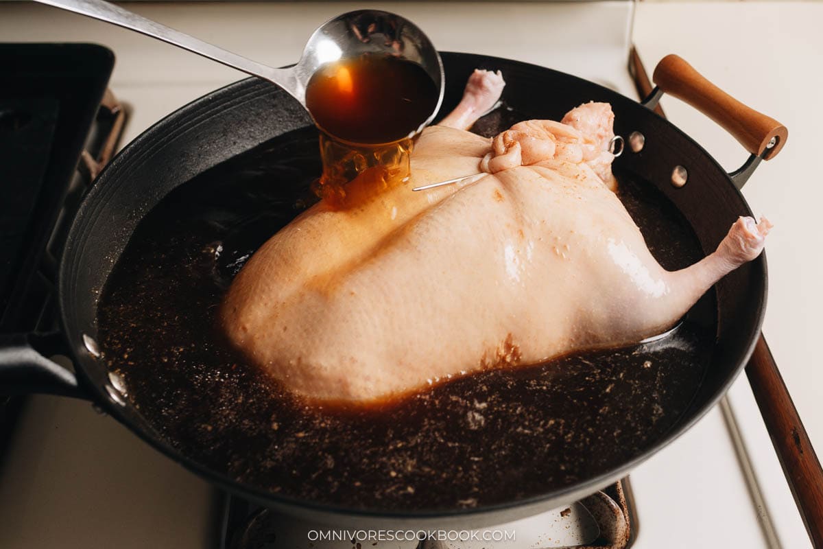 Blanching duck in a wok