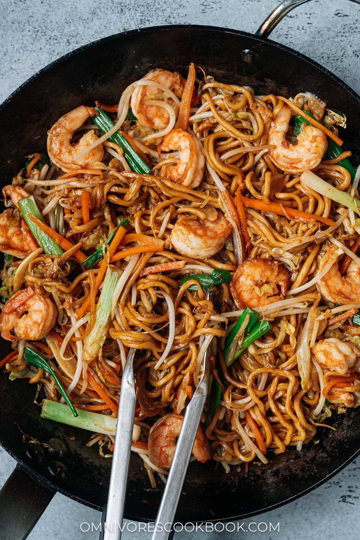 Homemade shrimp lo mein in a pan close up