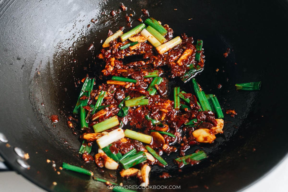 Cook the aromatics and doubanjiang for the broth base