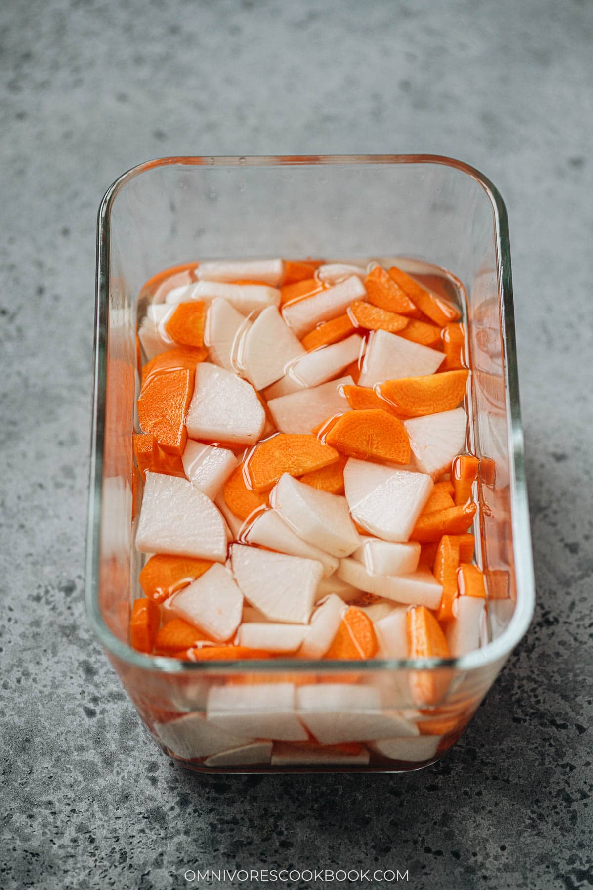 Pickled daikon with carrot in a container