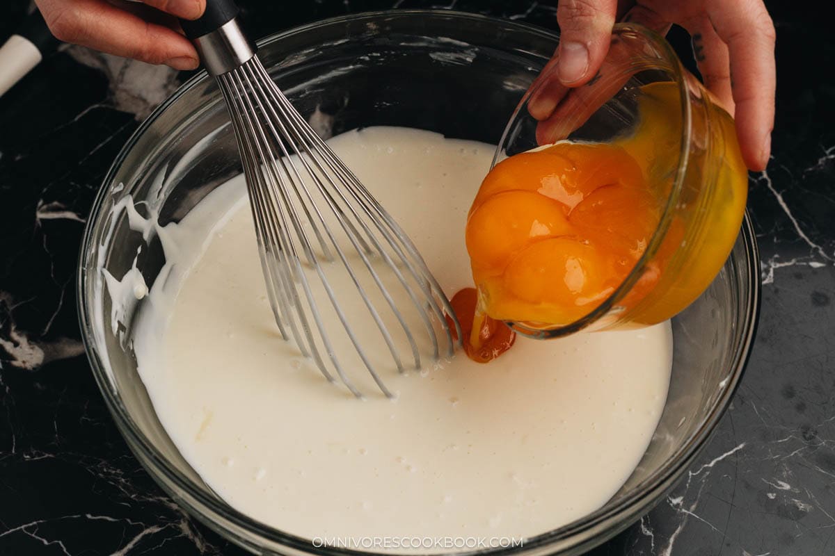 Whisking one egg yolk at a time