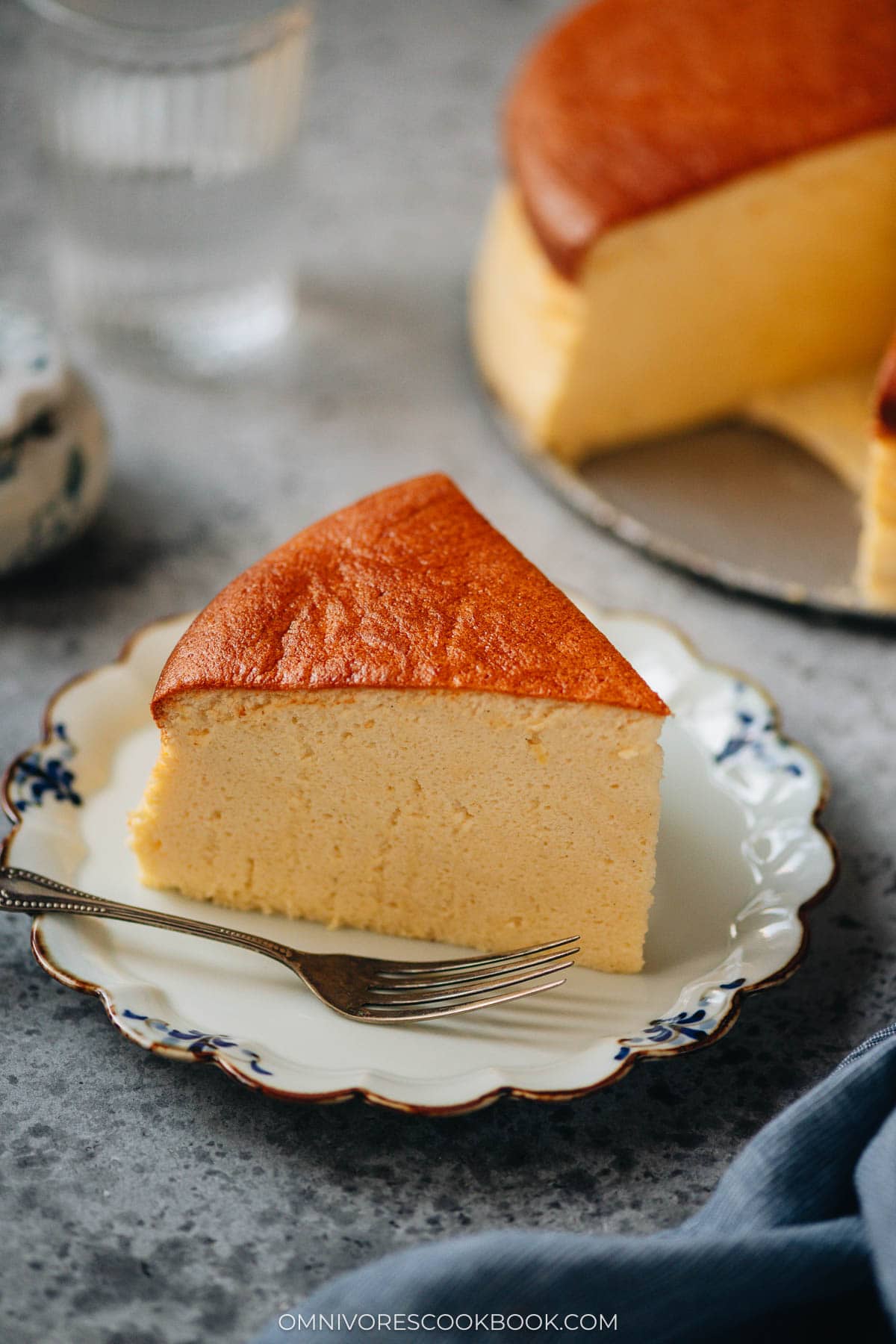 A slice of Japanese cheesecake served on a small plate