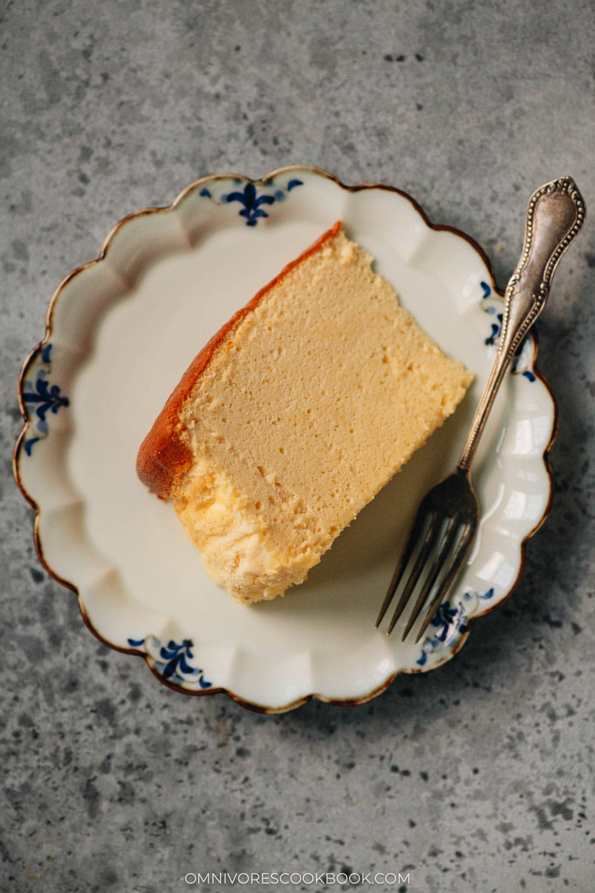 A slice of Japanese cheesecake on plate showing texture